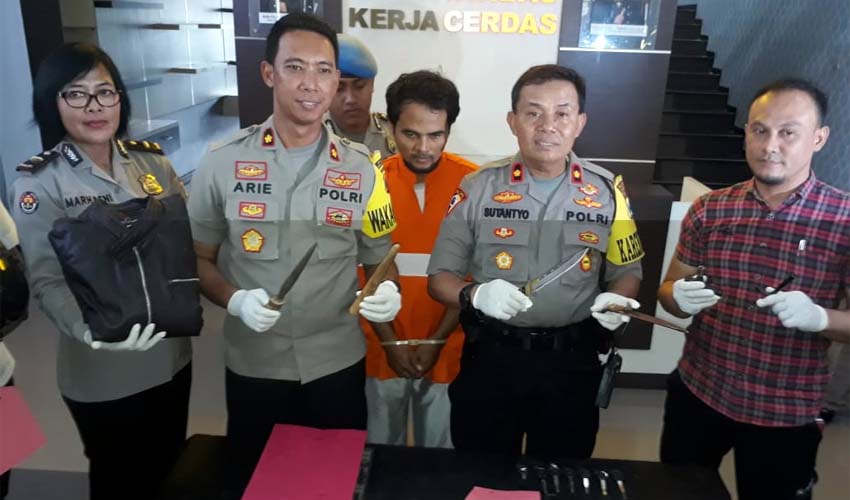 Tersangka Toha saat dirilis di Polresta Malang Kota. (gie)